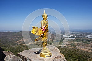 Buddha on cliff of Khao Phraya Doen Thong mountain for thai people travelers travel visit trail trekking go to respect praying