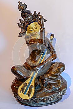 Buddha Dakini Statue playing music