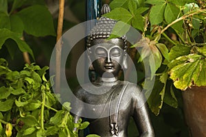 Buddha decorative statue in a green garden