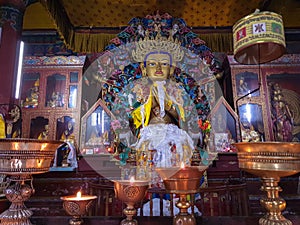 Buddha disciple golden statue close up shot at monastery from different perspective