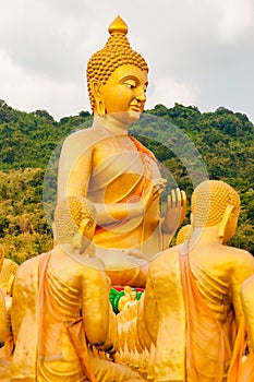 Buddha and disciplesculpture at Buddha Memorial park in Thailand