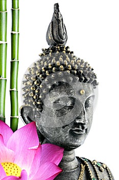 Buddha face with lotus flower and bamboo stem