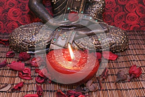 Buddha feet and candle