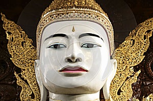 Buddha in gold, royal clothes,Ngar Htat Gyee pagoda,Yangon, Myanmar(Burma) photo