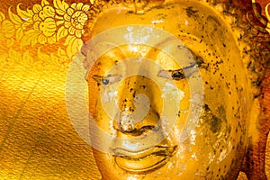 Buddha gold statue on golden background patterns Thailand.