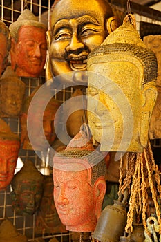 Buddha head masks and carvings