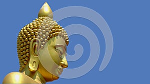 Buddha head statue against blue sky