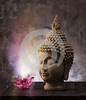 Buddha head statue and lotus flower decoration.