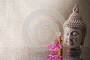 Buddha head statue  and orchid flower decoration