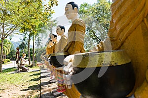 Buddha and his disciple statue in the forest