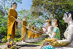 Buddha and his disciple statue in the forest