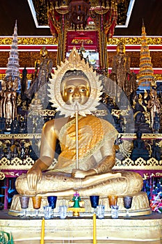 Buddha holding talipot fan at Wat Sang Soc