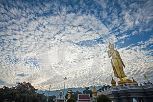 Buddha image and cirrocumulus clouds