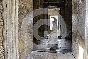 The Buddha image in the posture of Naga Prok carved from sandstone is located in the main prang of Prasat Hin Phimai