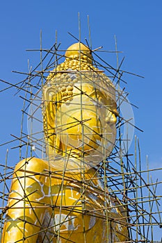 Buddha image reparation on the blue sky