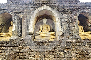 Buddha image on side of ancient pagoda,Sri Sacha Na Lai,Thailand