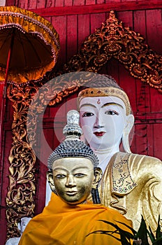 Buddha image on wooden background.