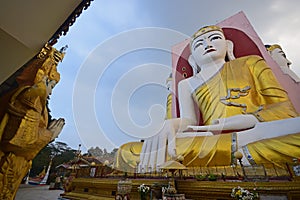 Buddha of Kyaik Pun Pagoda Bago meditating with roof on the left