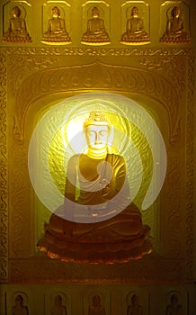 Buddha with long lighting candle