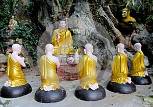 Buddha and monks statues in Buddhist temple