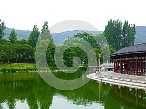 Buddha prayer wheels gallery near a lake