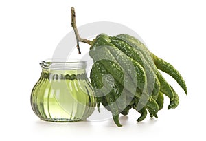 Buddha`s Hand or Citrus medica var. sarcodactylis fruit and oil isolated on white background