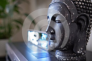 The Buddha's head in the home interior. The atmosphere of the prayer room. The altar.