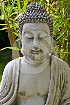 Buddha sculpture with bamboo leaves