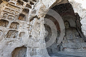 Buddha sculpture in cave interior of Luoyang Longmen Grottoes, Henan, China