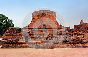 Buddha sculptures in the brick ruins of Wat Phra Sri Sanphet in the Royal Palace Ayutthaya, Thailand.