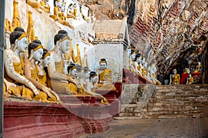 The Buddha sits in the Kaw Goon Cave in Hpa An Town, Kayin State, Myanmar. It is a natural limestone cave