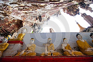 The Buddha sits in the Kaw Goon Cave in Hpa An Town, Kayin State, Myanmar. It is a natural limestone cave.