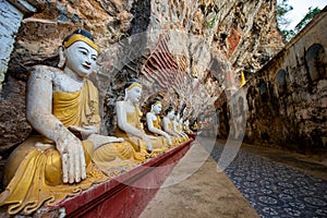 The Buddha sits in the Kaw Goon Cave in Hpa An Town, Kayin State, Myanmar. It is a natural limestone cave.