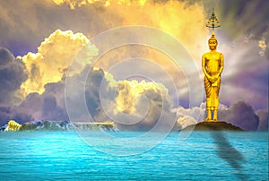 Buddha stands majestically, quietly, there is an evening sky with the sea as the background.