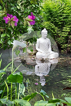 Buddha statue in Andre Heller garden photo