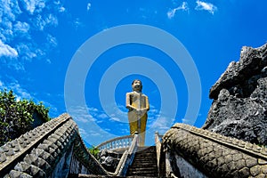 Buddha statue on blue sky background