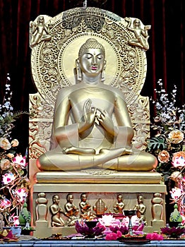 Buddha statue in a Buddhist temple Mulagandhakuti Vihara in Sarnath, India