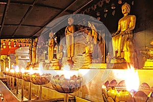 Buddha statue candle light in chaing mai Thailand