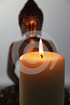 Buddha Statue and Candlelight