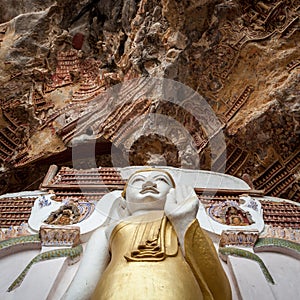 Buddha statue with carvings in Kaw Goon cave in.