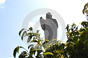 Buddha statue with clouds background