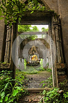 Buddha statue in decadent chapel at Sangkhla Buri.