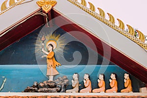 Buddha statue with disciple in temple