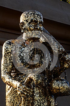 Buddha statue with enormous gold leafs.