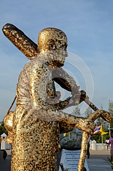 Buddha statue with enormous gold leafs.