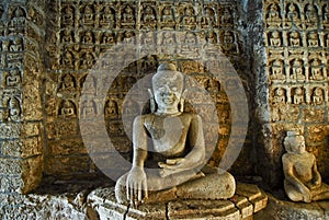 Buddha statue with figurines