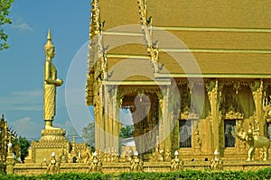 Buddha statue in front of the golden temple Wat Thai