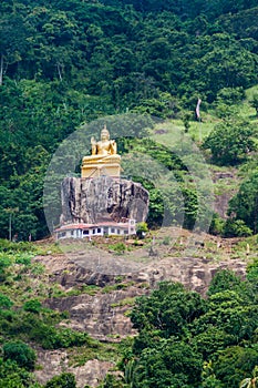 Buddha statue at a hill slope near Aluvihare Rock Temple, Sri Lan