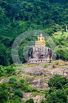 Buddha statue at a hill slope near Aluvihare Rock Temple, Sri Lan