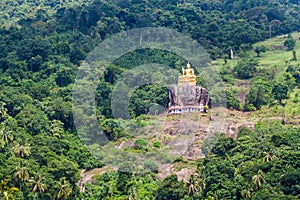 Buddha statue at a hill slope near Aluvihare Rock Temple, Sri Lan